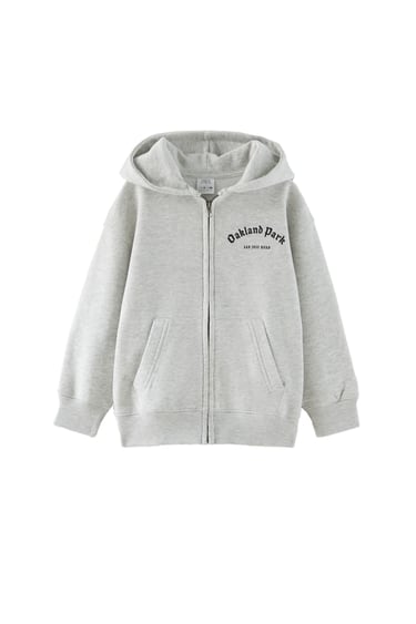 Image 0 of PLUSH JACKET WITH TEXT from Zara