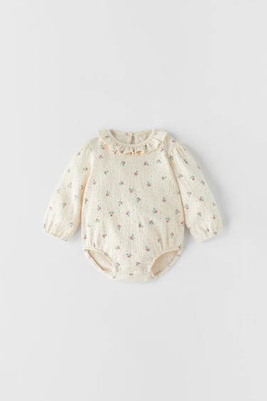 Image 0 of FLORAL RUFFLED COLLAR TEXTURED BODYSUIT from Zara