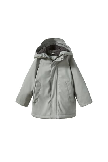 Image 0 of RUBBERISED FAUX SHEARLING RAINCOAT from Zara
