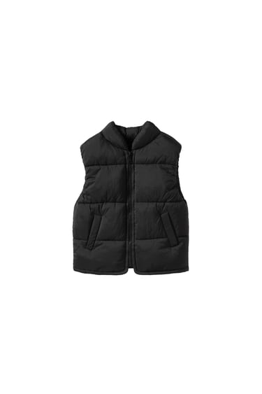 Image 0 of Quilted vest with high collar and front zip closure. Front pockets. from Zara