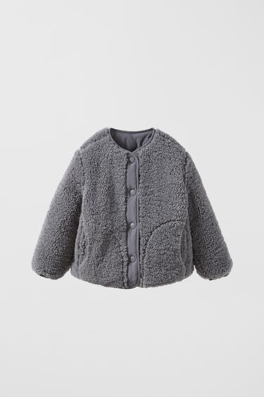 Image 0 of REVERSIBLE FAUX SHEARLING QUILTED JACKET from Zara