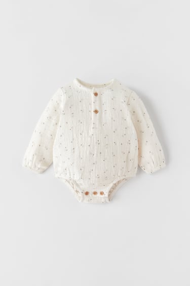 Image 0 of PRINTED TEXTURED BODYSUIT from Zara