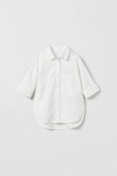 Image 0 of Poplin lapel collar shirt with long sleeves. Front button closure. Patch pocket at chest. from Zara