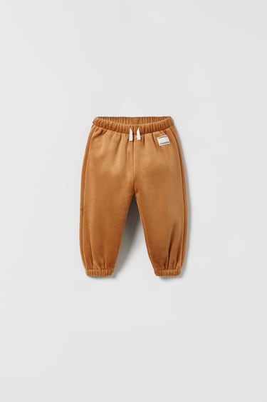 Image 0 of CORDUROY FAUX SHEARLING TROUSERS from Zara