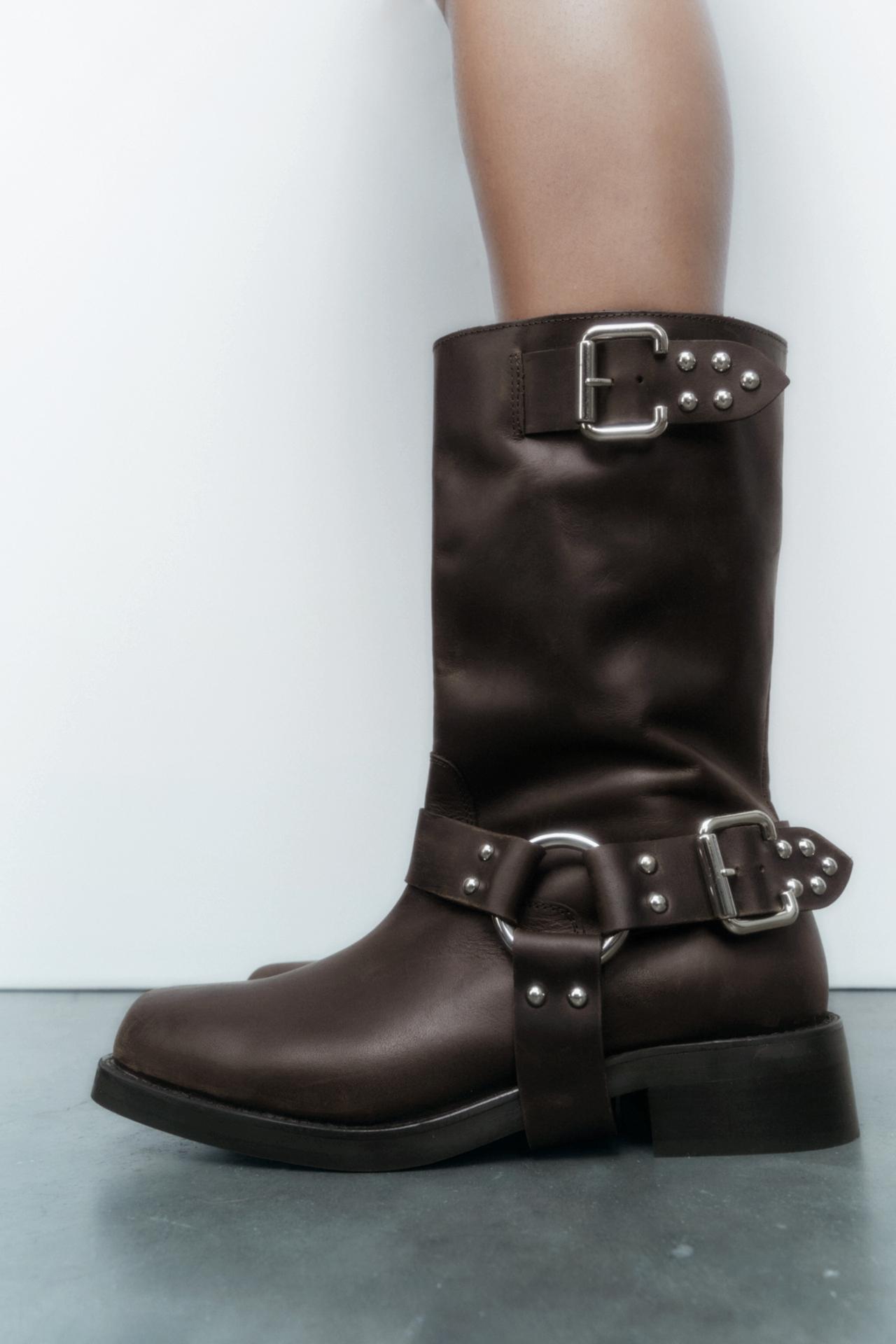 Zara Leather biker boots with buckles. These on trend biker boots have Leather straps with decorative studs and metal buckles around the ankle and at the top. Square toe, flat soles with low heel.