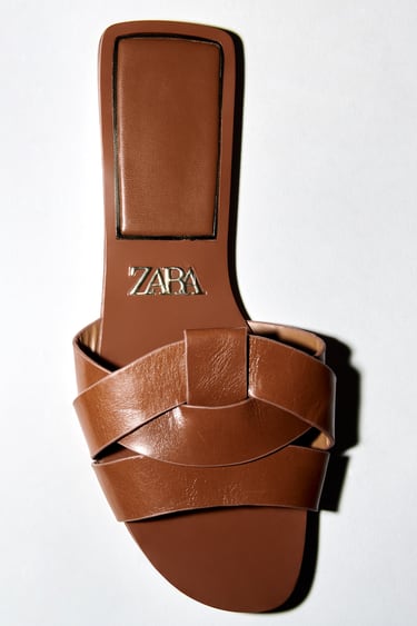 Image 0 of FLAT CRISS-CROSS LEATHER SLIDER SANDALS from Zara