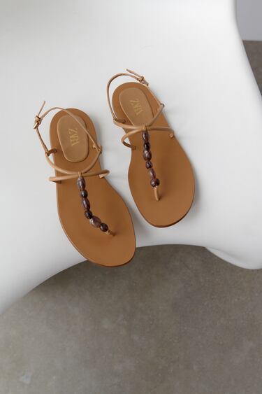 FLAT SANDALS WITH STONE BEADS