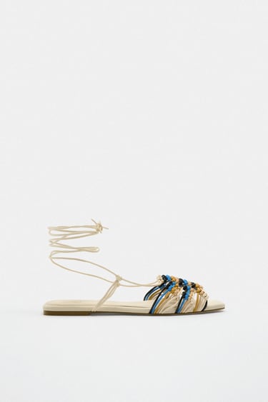 Image 0 of LACE UP WOVEN FLAT SANDALS from Zara