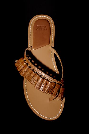 FLAT LEATHER SANDALS WITH TASSELS