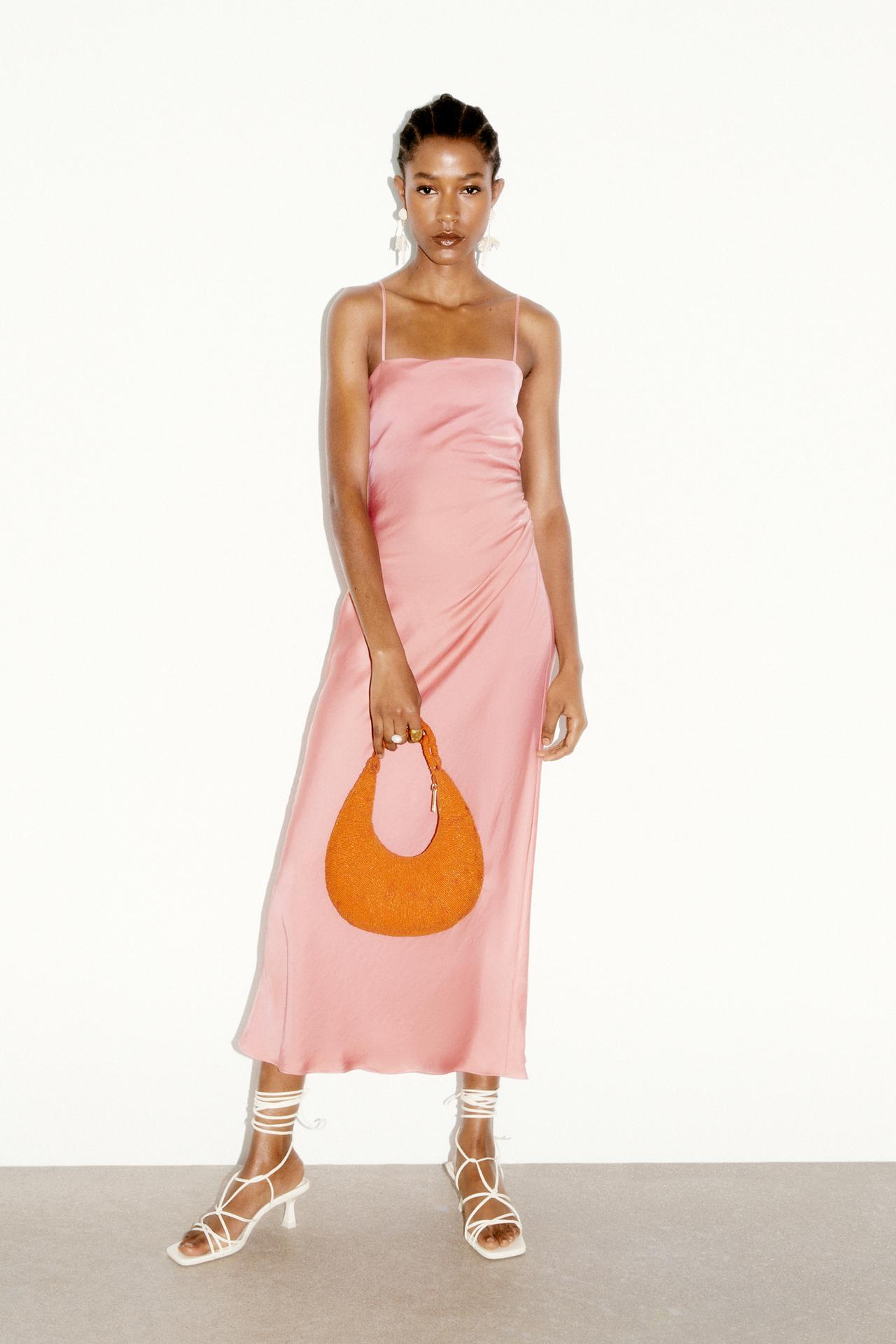 Beige pink Midi dress with a straight neckline and thin straps. Side gathered details. Invisible side zip fastening.