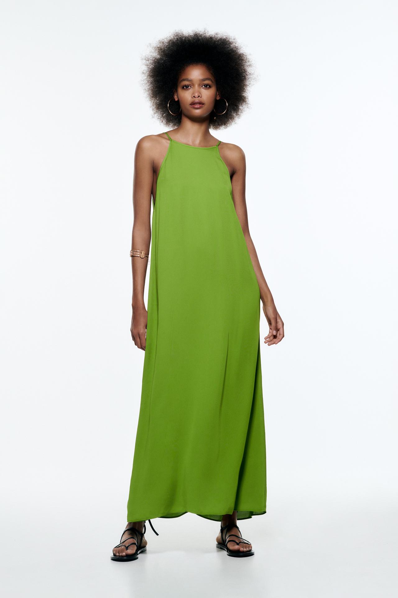 Green Halter maxi dress with thin straps. Matching side topstitching detail.