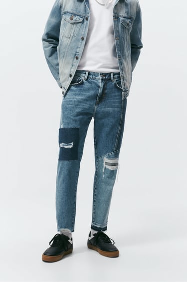 JEANS WITH RIPS AND PATCHES