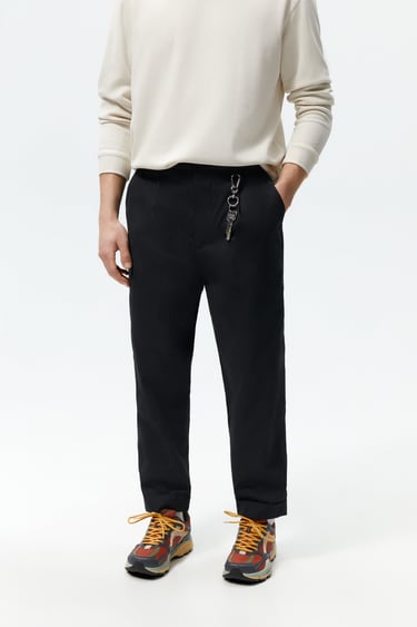 PLEATED CHINO TROUSERS