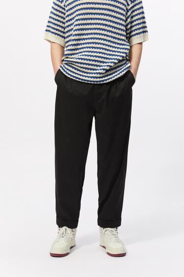 PLEATED CHINO TROUSERS