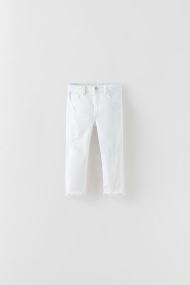 THE WHITE RIPPED SLIM FIT JEANS