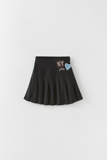 BOX PLEAT SKIRT WITH PATCHES