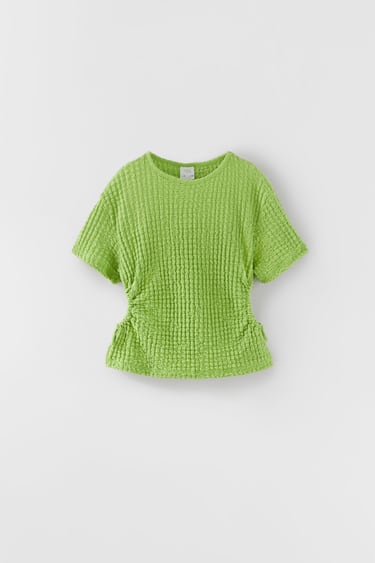 CUT-OUT TEXTURED TOP