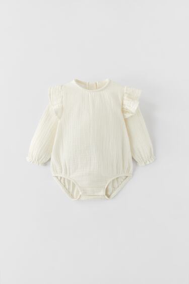 TEXTURED BODYSUIT WITH RUFFLE