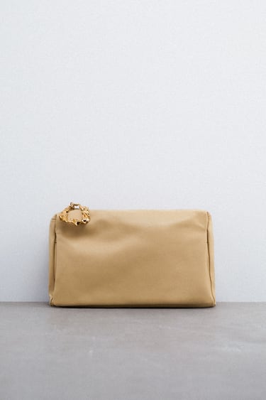 LEATHER CLUTCH BAG WITH METALLIC DETAIL