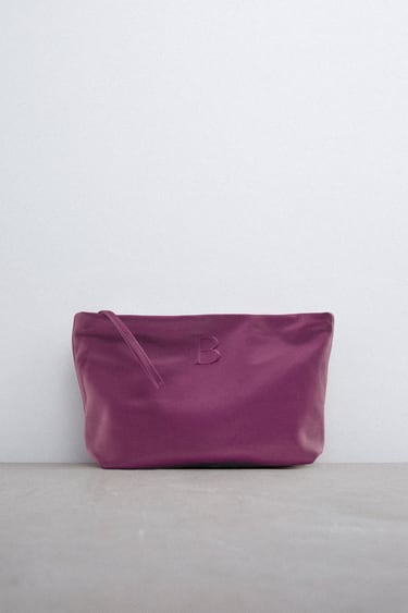 LEATHER CLUTCH BAG WITH LETTER
