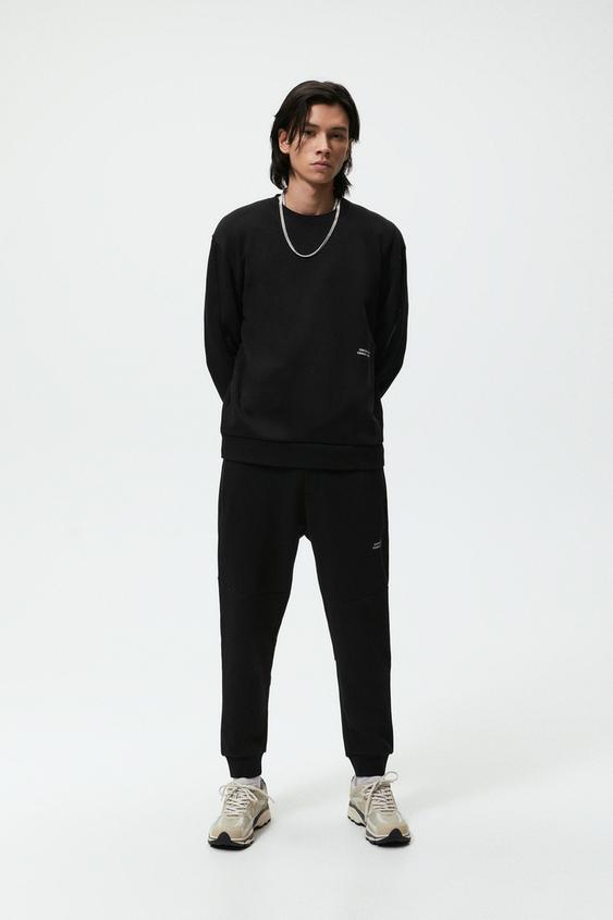 SUDADERA BÁSICA CREMALLERA - Negro | ZARA Chile