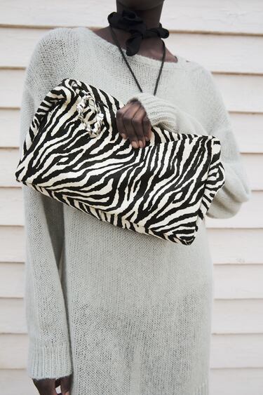 LEATHER CLUTCH WITH ANIMAL PRINT