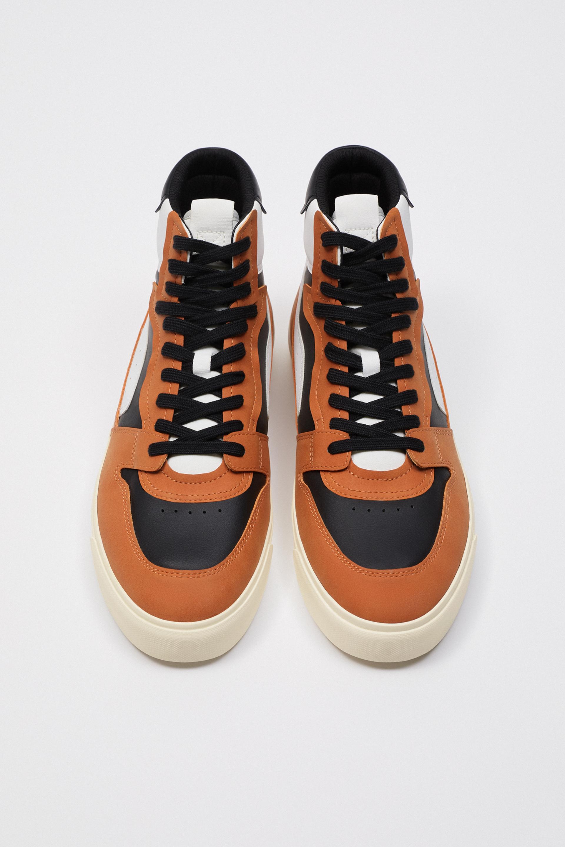 orange and burgundy sneakers