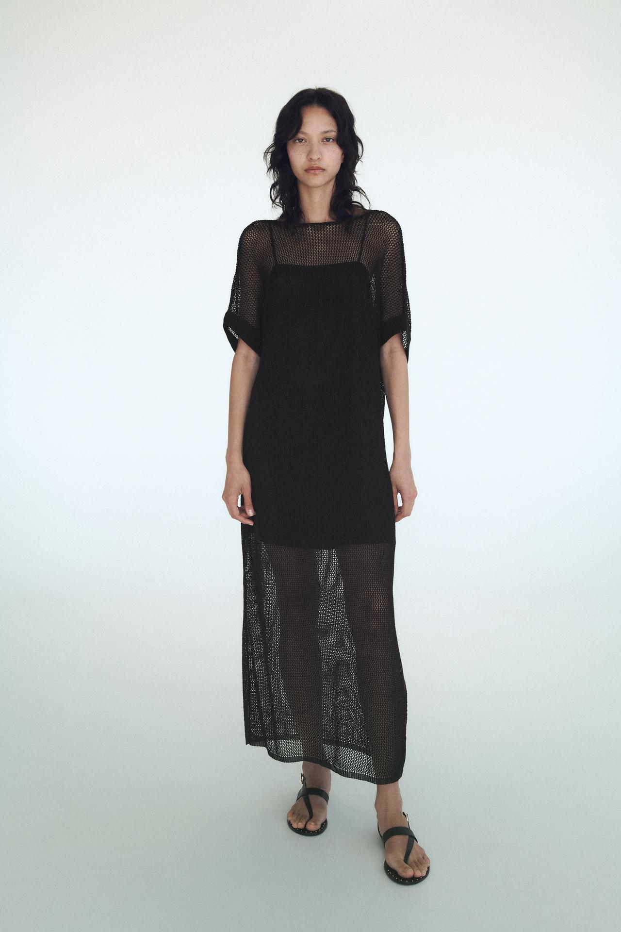 Zara black Short sleeve tunic with a round neckline. Featuring a V-back.