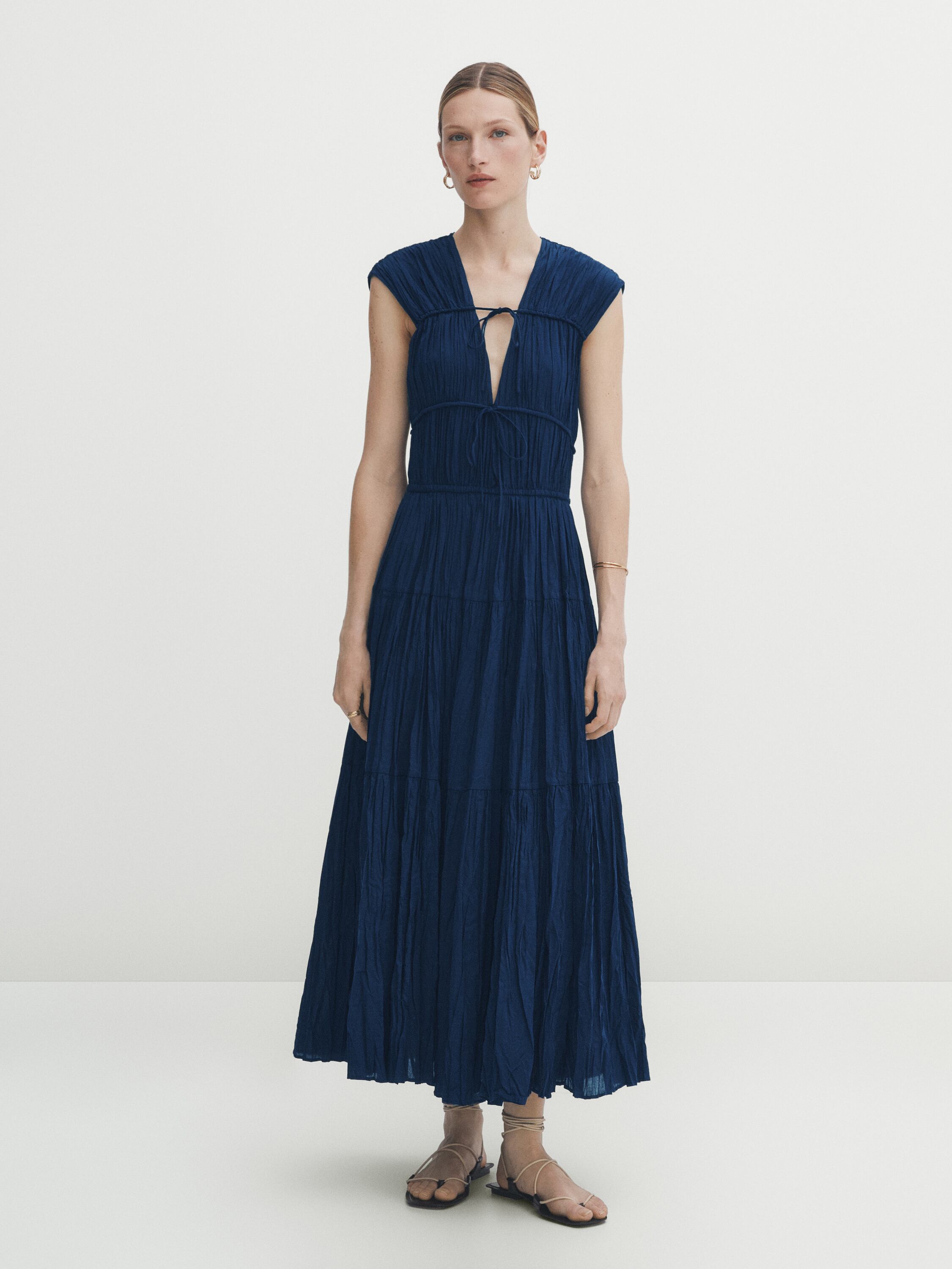 Pleated dress with tie details