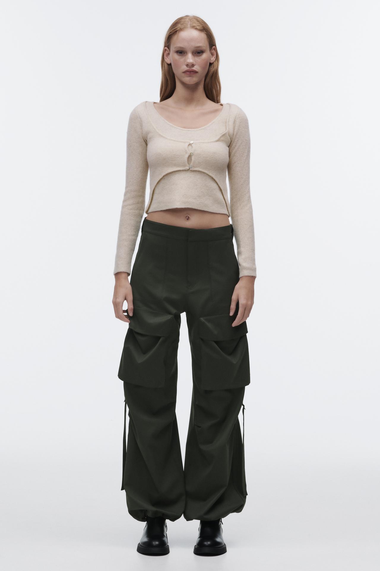 Zara wool blend sweater with buttons. This cream double layer sweater made of a wool blend features a round neckline, long sleeves and layered detail in the same fabric with buttons on the front.