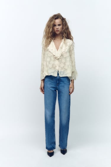 Image 0 of RUFFLED BLOUSE WITH FEATHERS from Zara