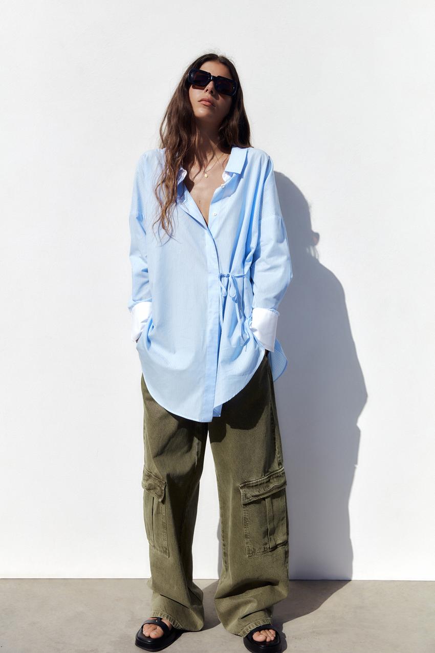 Zara light blue and white long oversized striped shirt with button front and tie detail at the side.
