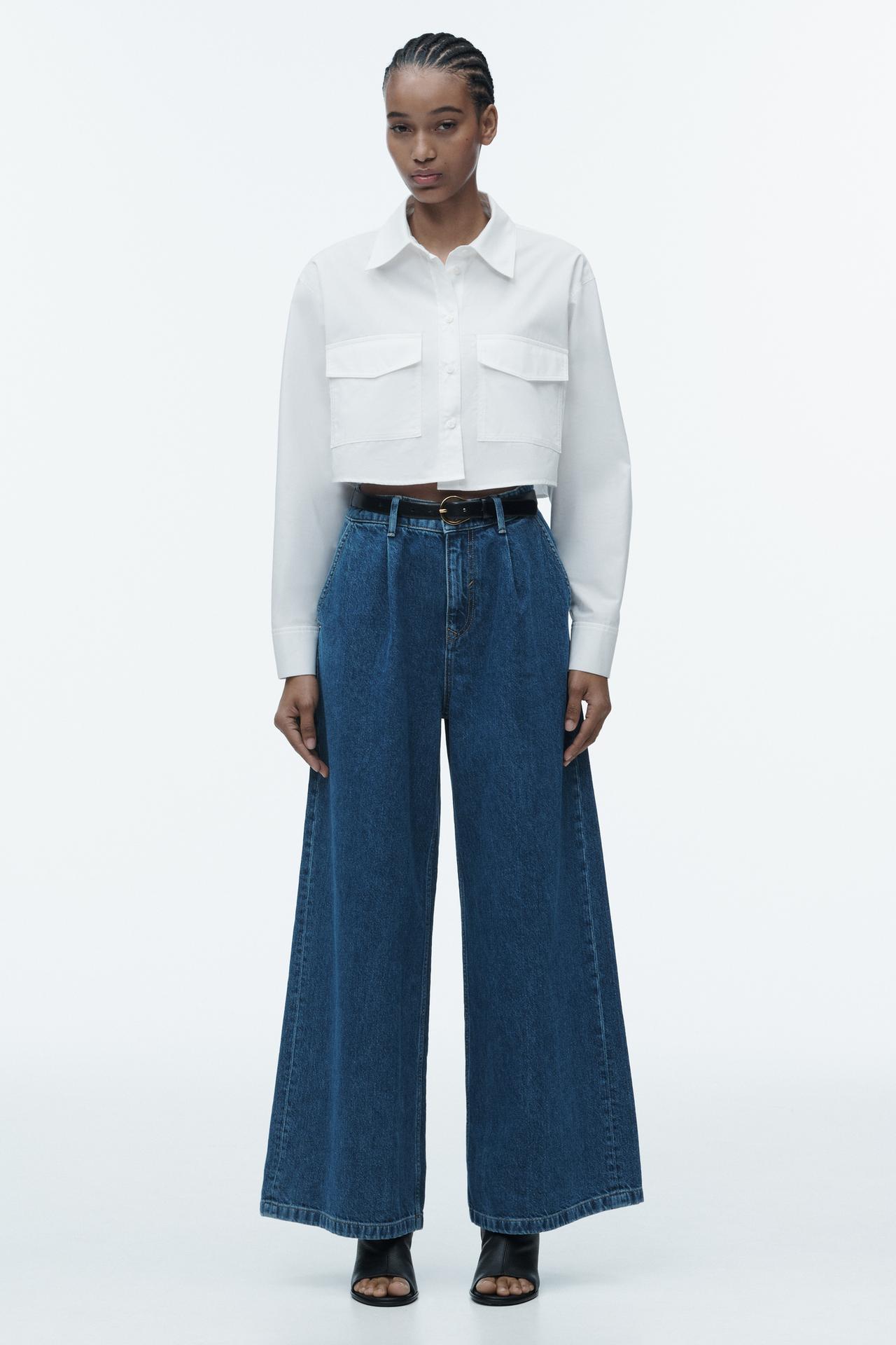 Zara PALAZZO JEANS with a
High-waist and darts on the front. These wide jeans have front pockets, rear patch pockets, wide legs, and zip fly and top button fastening.