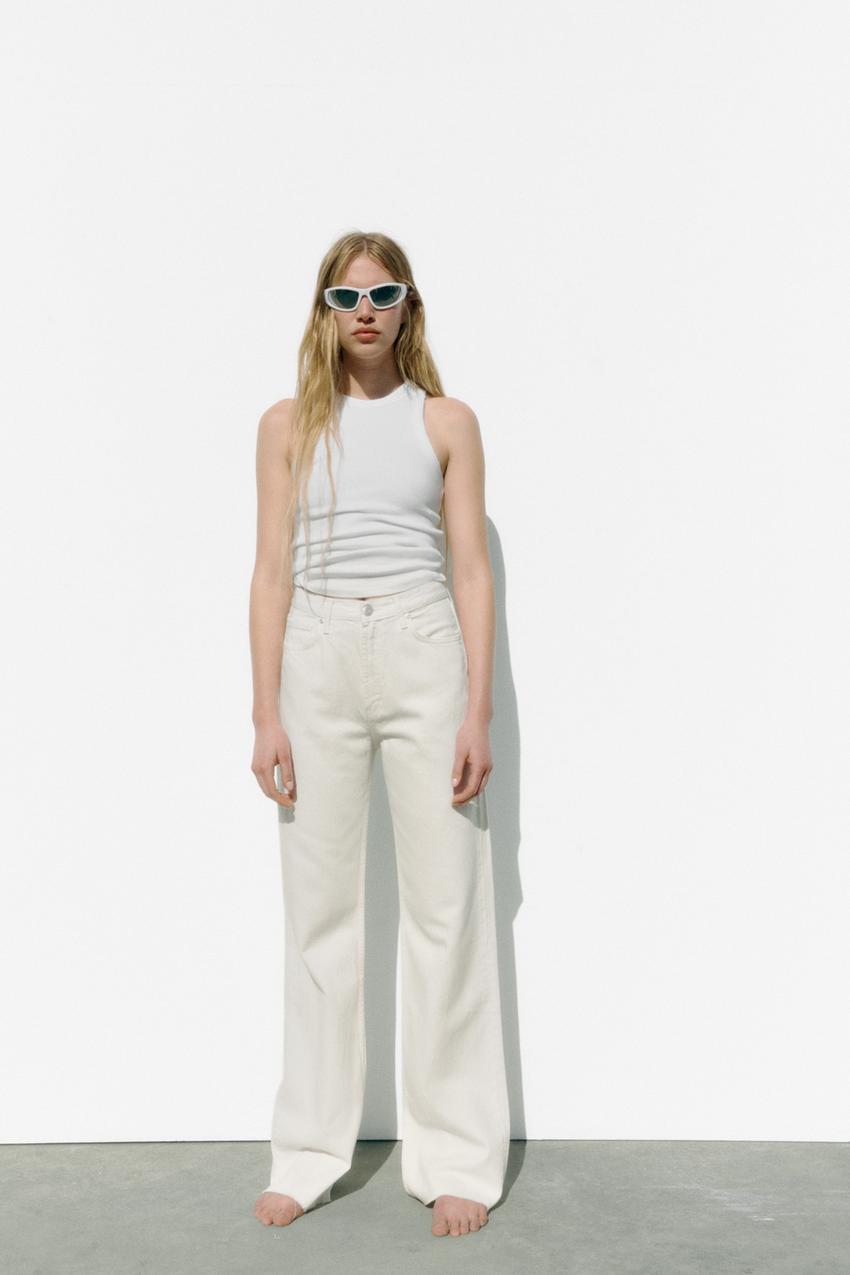 Zara HIGH RISE - WIDE LEG - FULL-LENGTH jeans in oyster white. Rigid high-rise jeans with a five-pocket design. Extra-long wide legs. Zip fly and metal top button fastening.