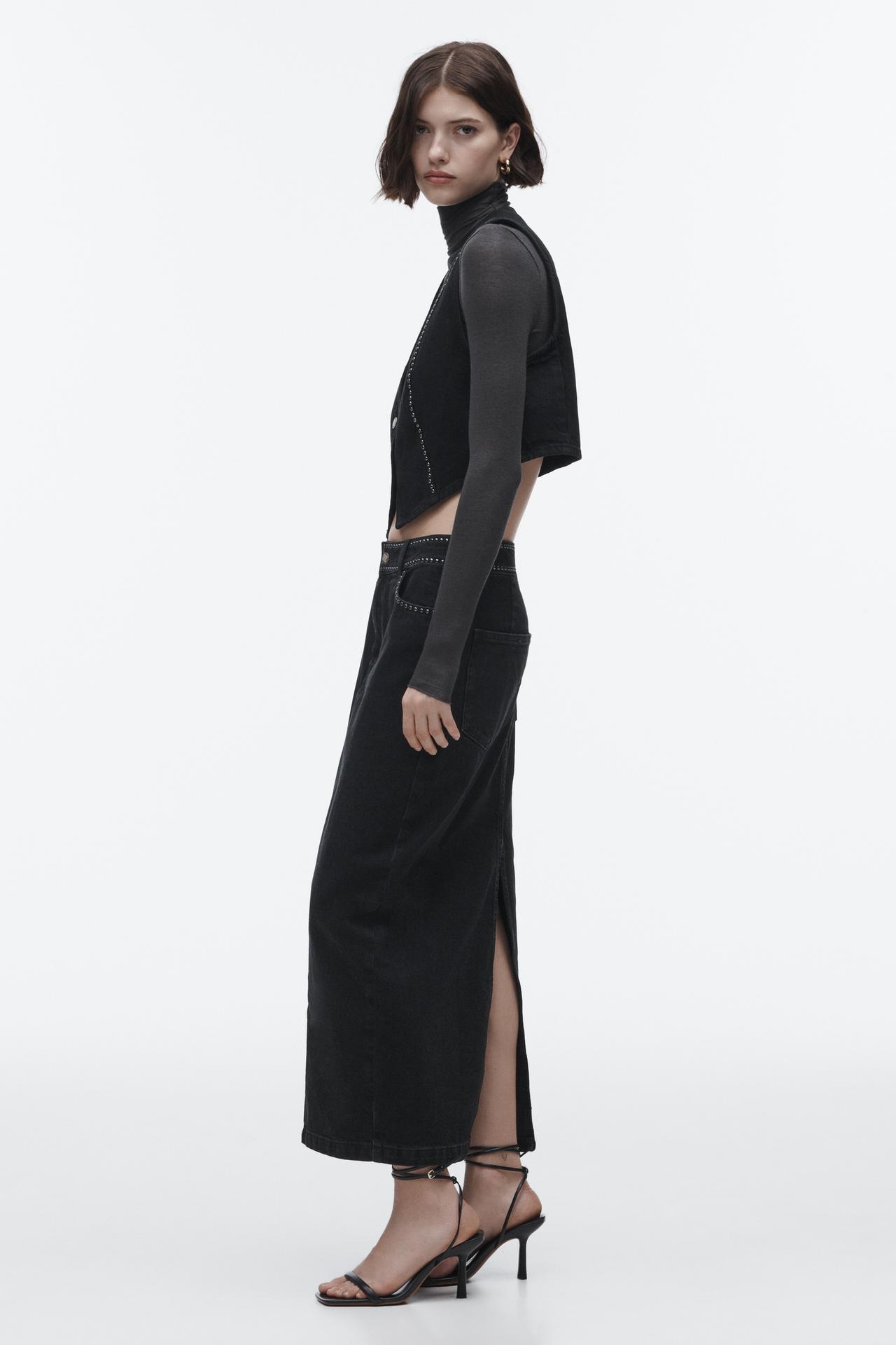 Zara studded denim skirt. This denim skirt has a High-waist skirt with front pockets and back patch pockets. Featuring stud details, a back slit at the hem and zip fly and metal button fastening at the front.