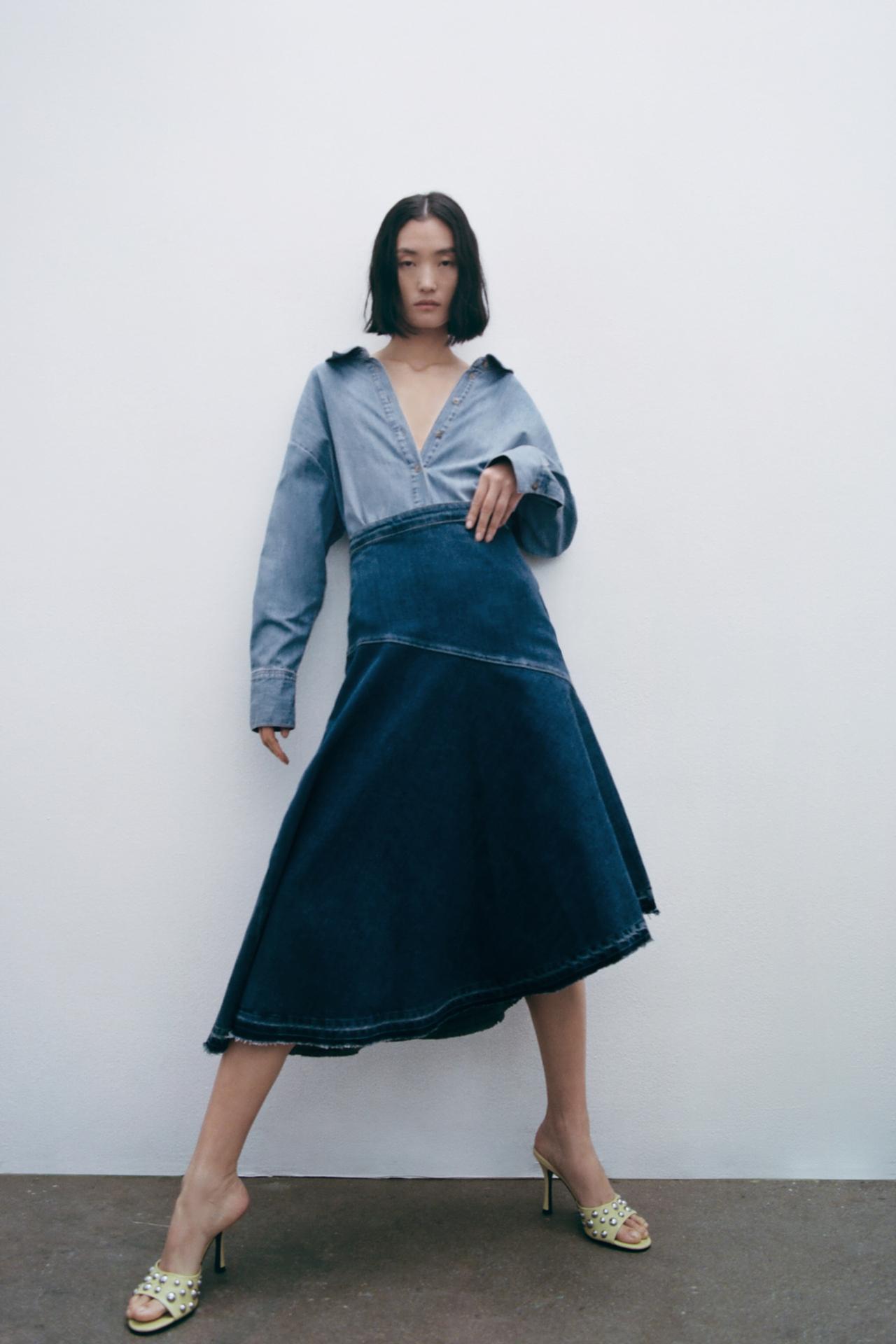 Zara denim asymmetric midi skirt. This denim skirt has a High-waist midi, Contrast visible topstitching detail, and an Asymmetric frayed hem with invisible side zip fastening.