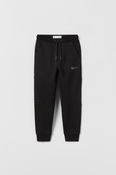 Image 0 of SPORTY TROUSERS WITH REFLECTIVE PRINT from Zara