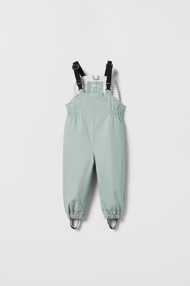 Image 0 of RUBBERISED DUNGAREES from Zara