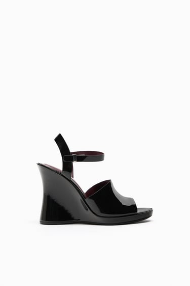 Image 0 of PATENT FINISH WEDGE SANDALS from Zara