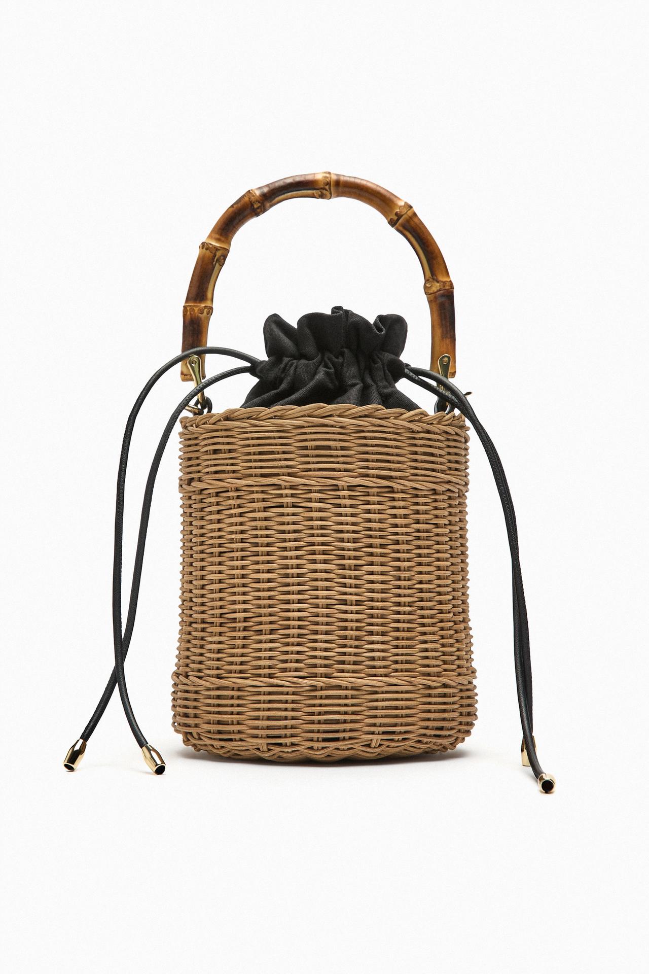 wedding guest accessories to elevate your 2023 wedding guest outfit. Zara's cute Basket bucket bag with wooden top Handle and long detachable crossbody strap. has a Gathered drawstring inner lining closure. It would make the perfect addition to a country side wedding guest look.