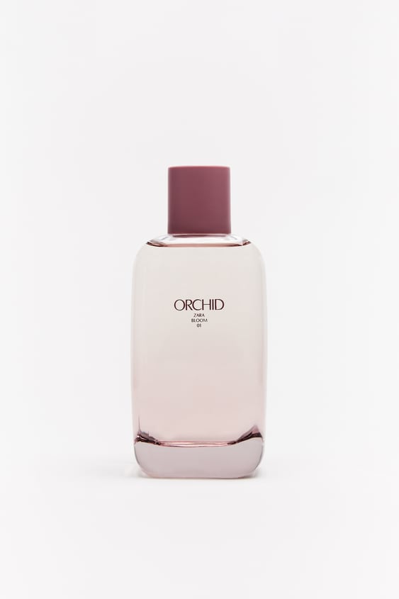 Tall, sleek bottle of Zara Orchid perfume with a matte maroon cap on a white background, labeled 'ORCHID' in black font.