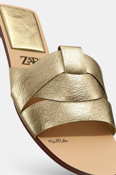 FLAT CRISS-CROSS LEATHER SLIDER SANDALS - Gold by Zara - Image 1