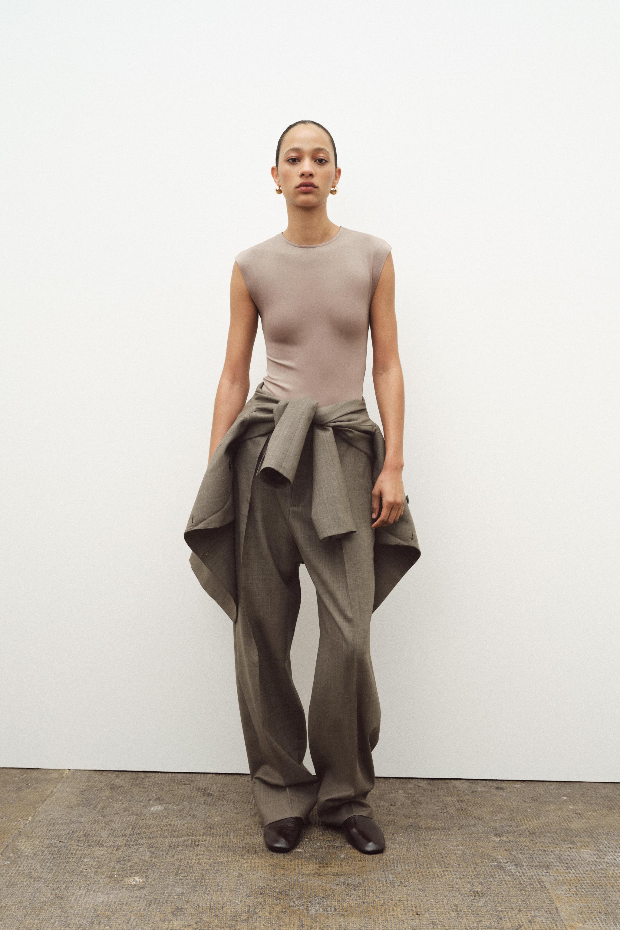 SLEEVELESS BODYSUIT