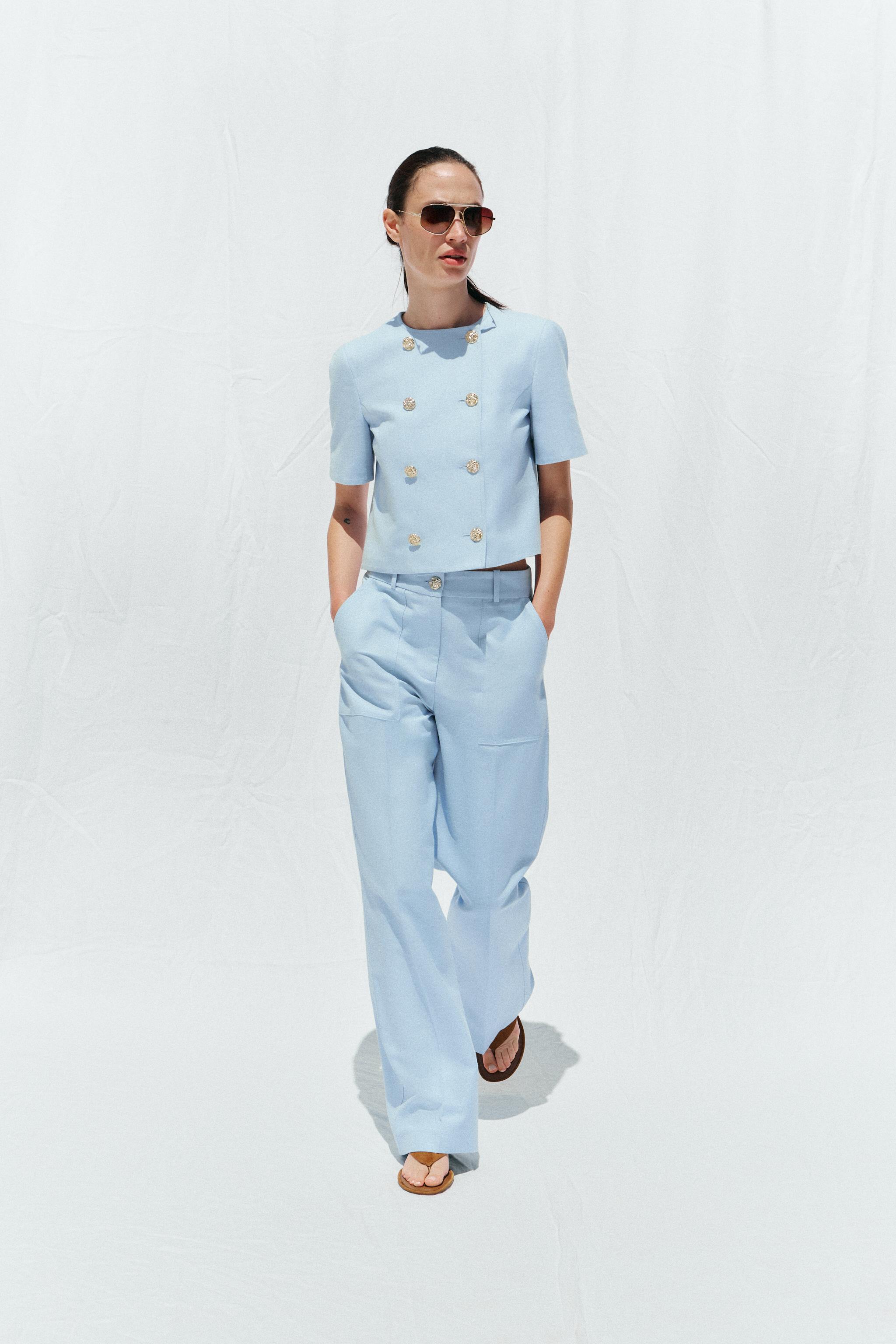 STRAIGHT-LEG TROUSERS WITH METAL BUTTON