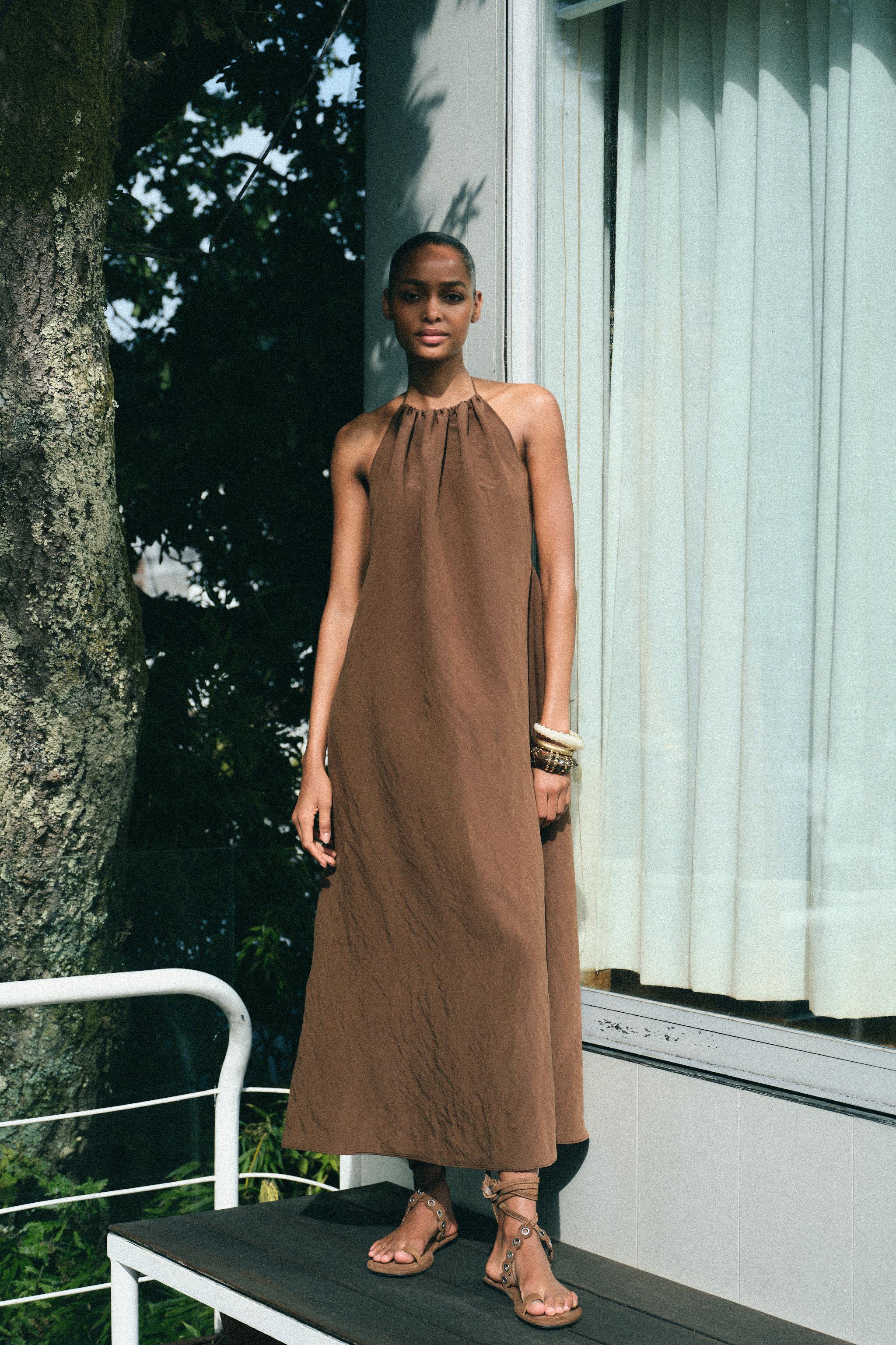FLOWING OPEN BACK HALTERNECK DRESS