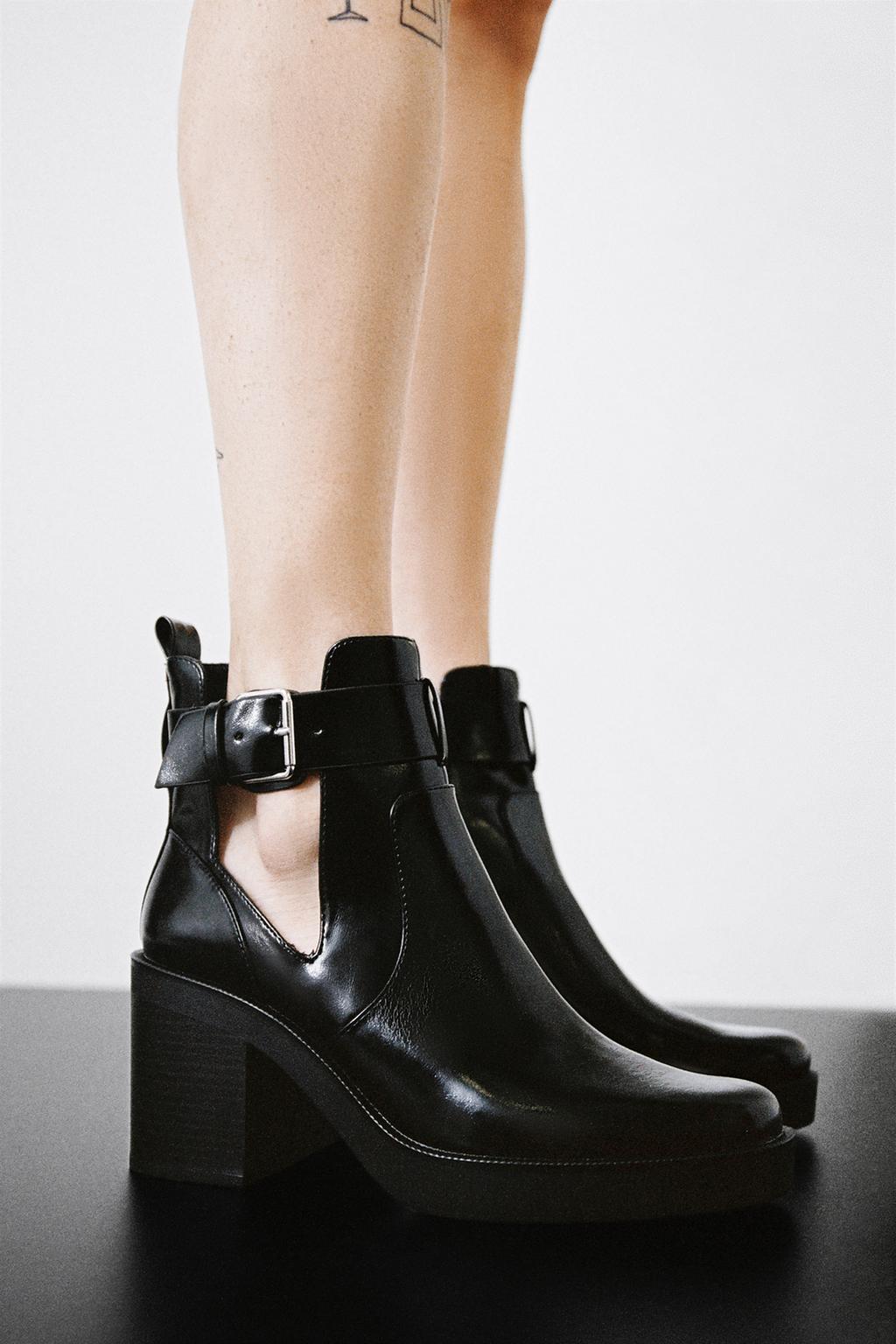 Heeled boots with cutouts
