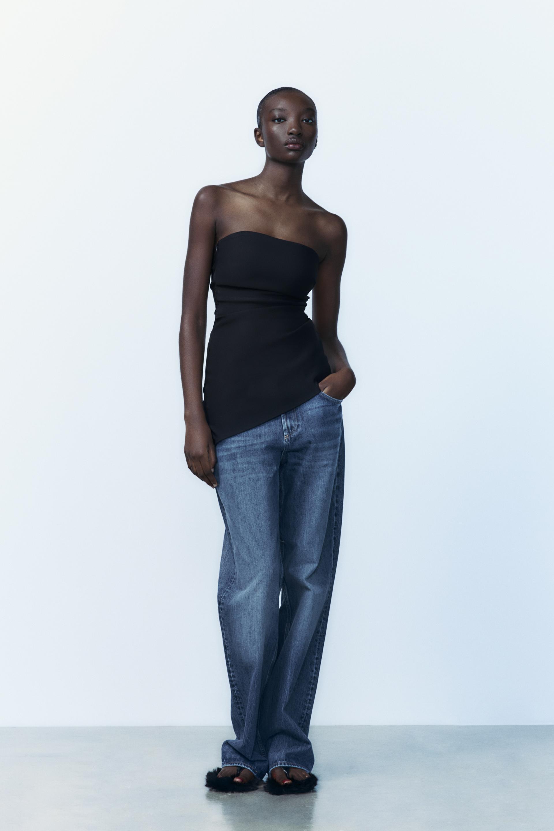 Asymmetric pleated top