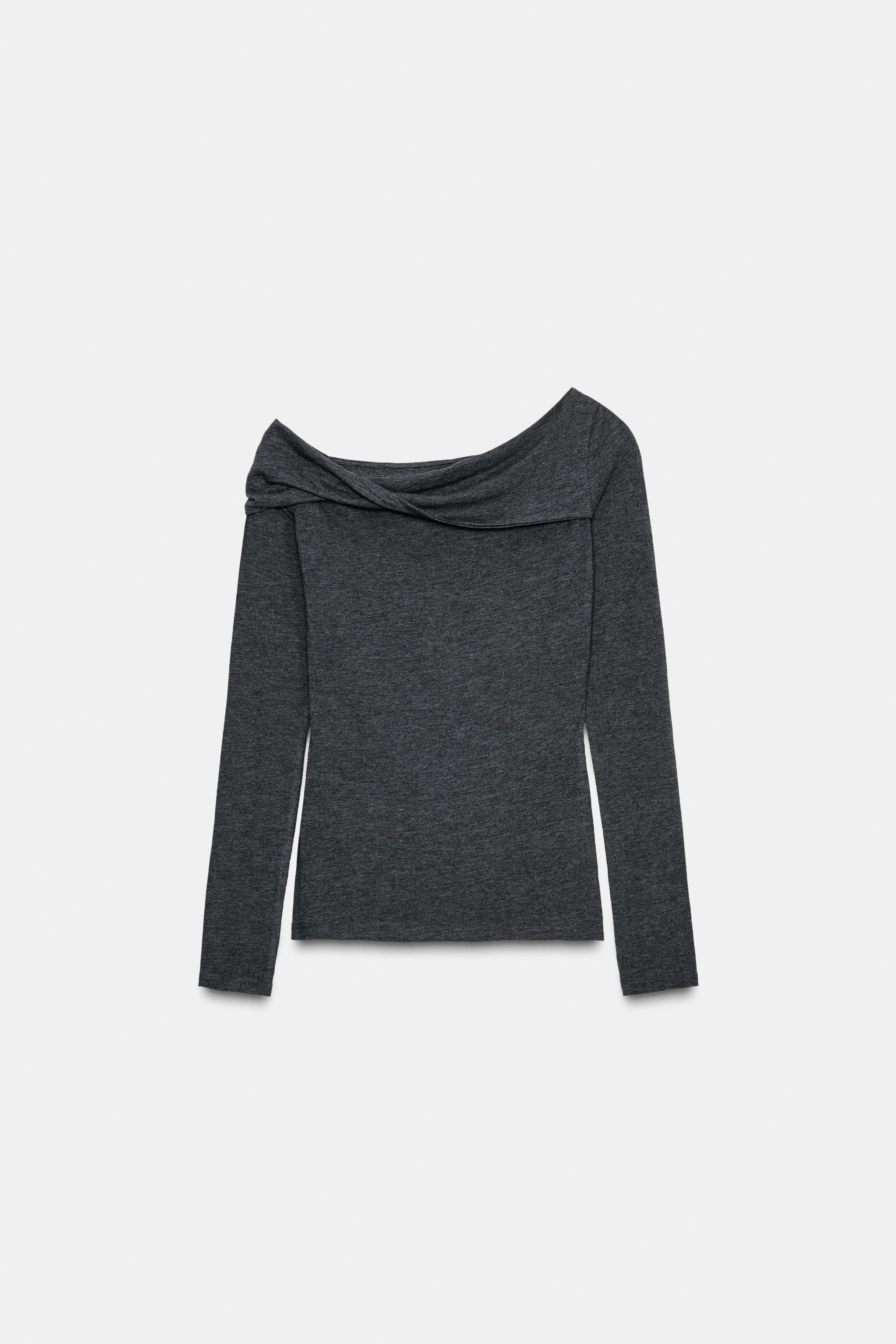 Asymmetric neck top
