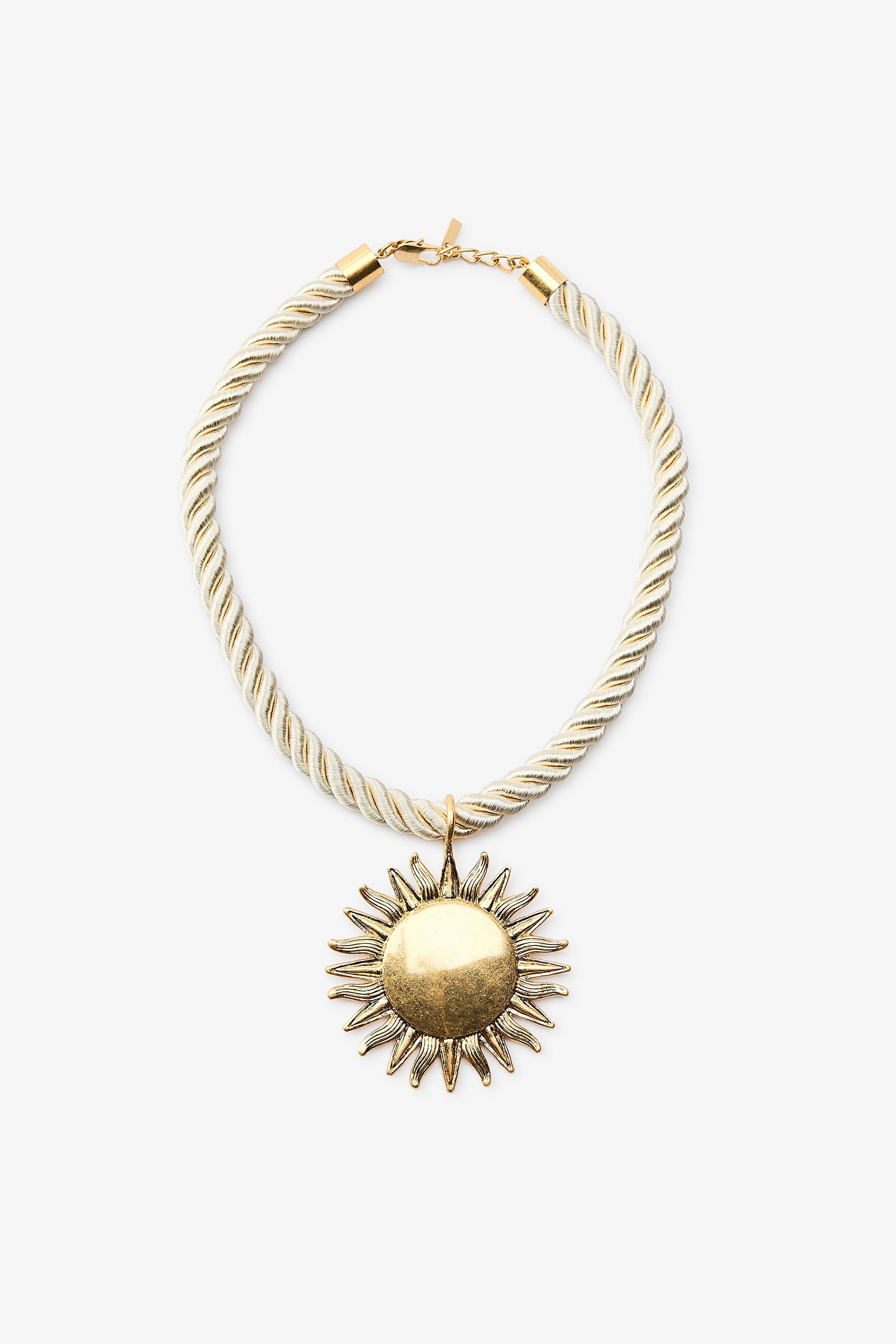 Sun motif necklace