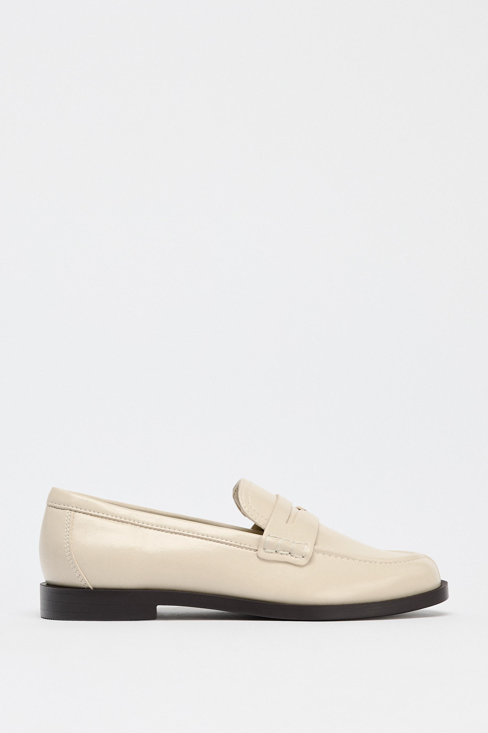 Moccasins with decorative strap